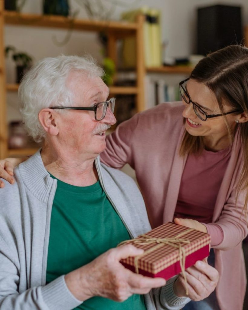 happy-woman-surprising-her-senior-father-when-visiting-him-at-home-and-bringing-present- happy-woman-surprising-her-senior-father-when-visiting-him-at-home-and-bringing-present-